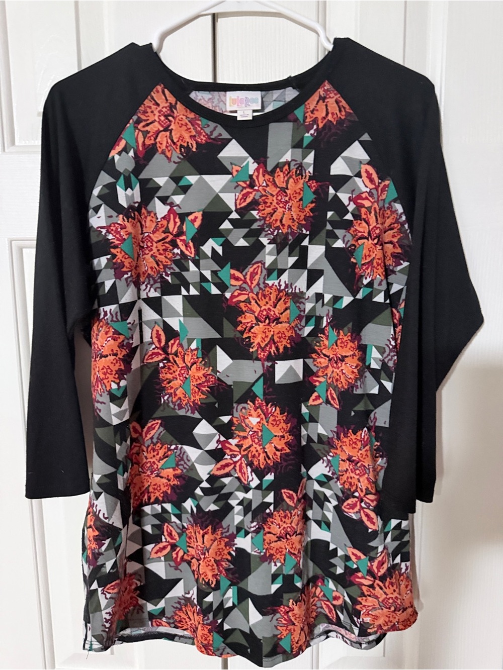 LuLaRoe Black “Randy” shirt with Orange Floral Geometric Print
